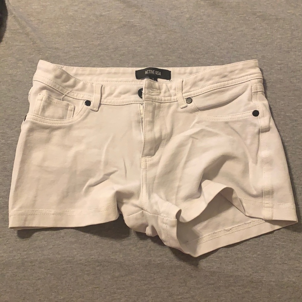 Small white shorts from Q. Brand is Active USA